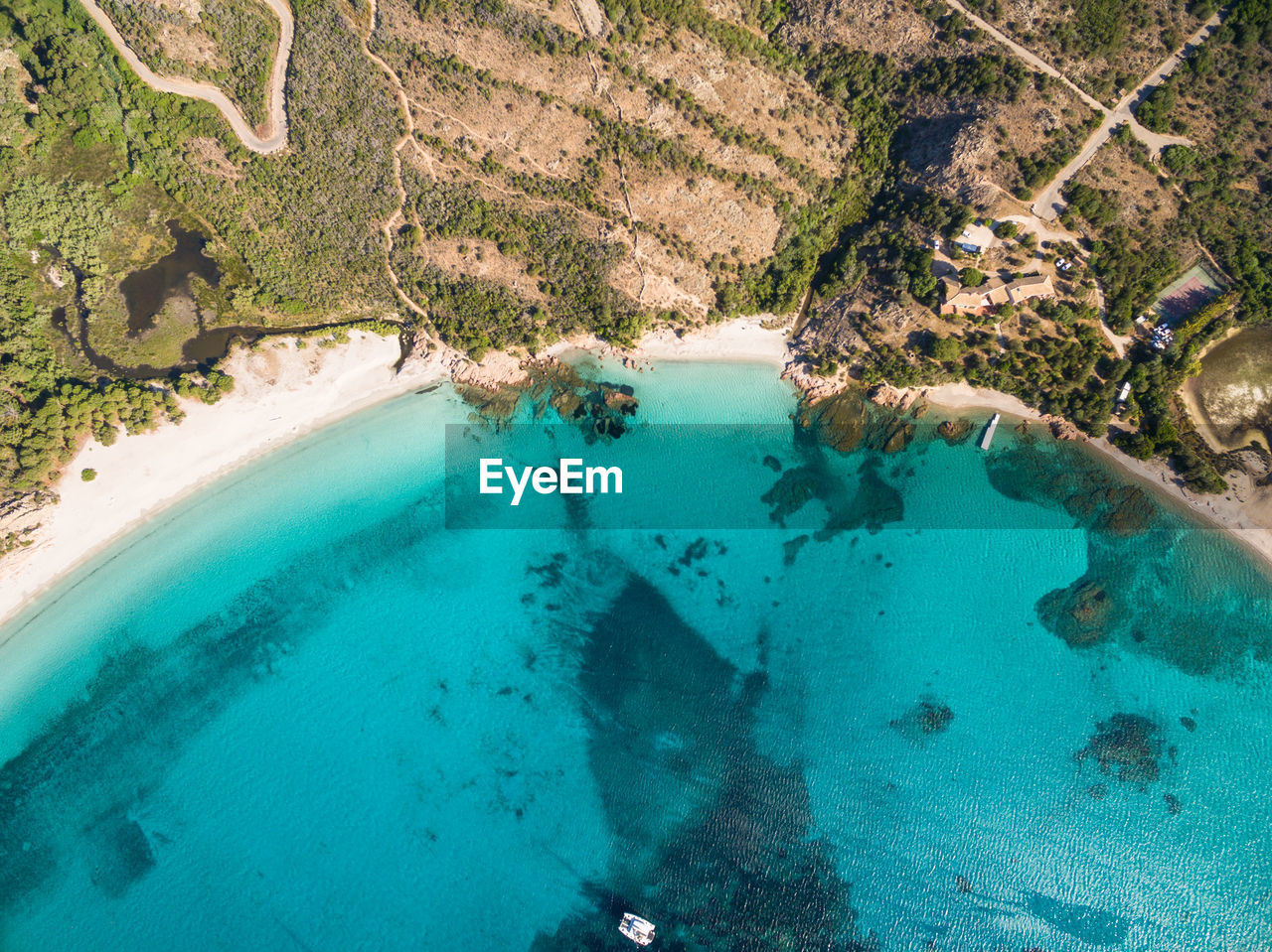 HIGH ANGLE VIEW OF SEA SEEN THROUGH ROCKS