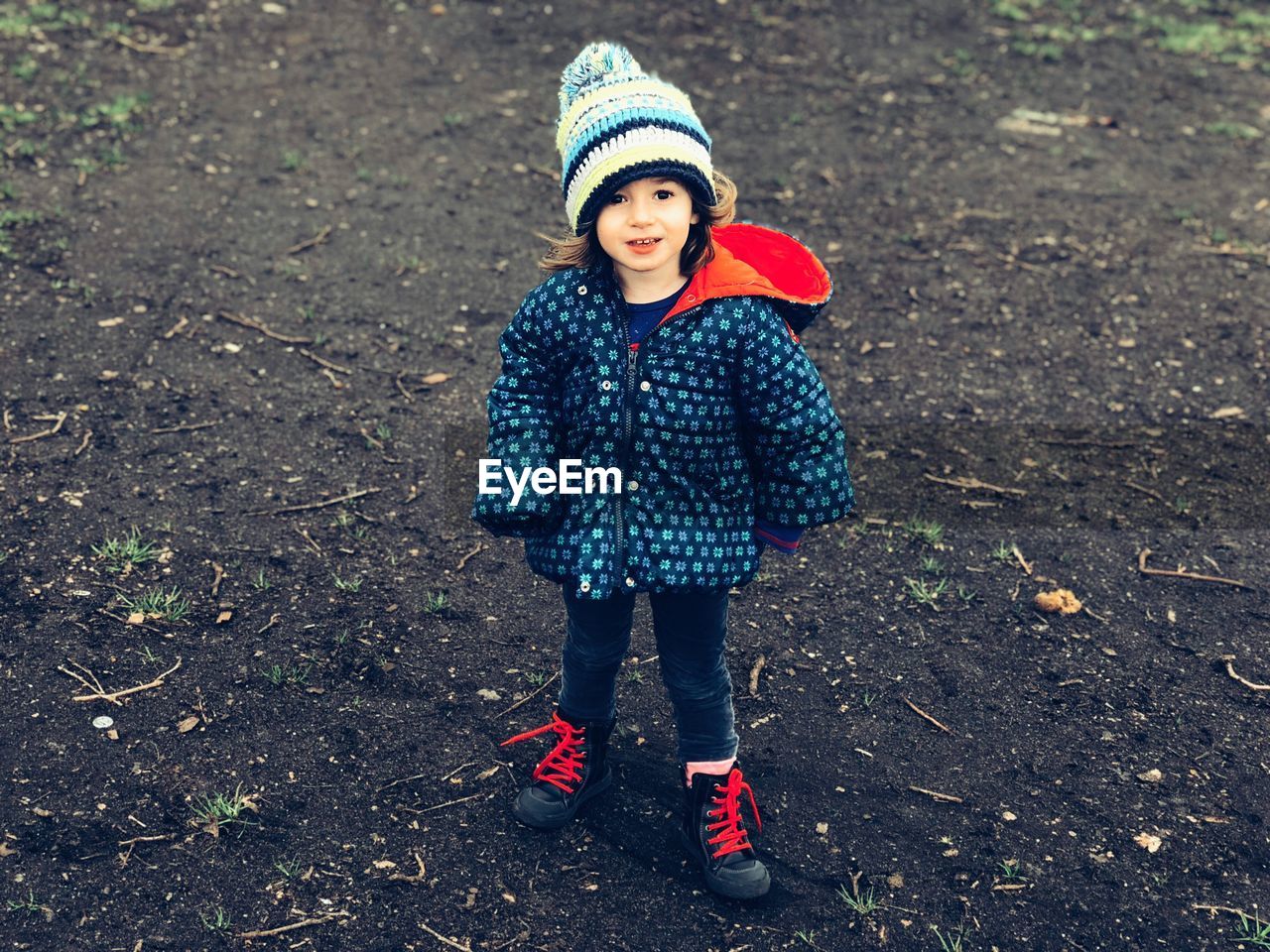 Full length portrait of girl on field