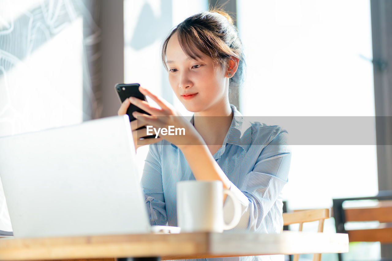 young woman using phone