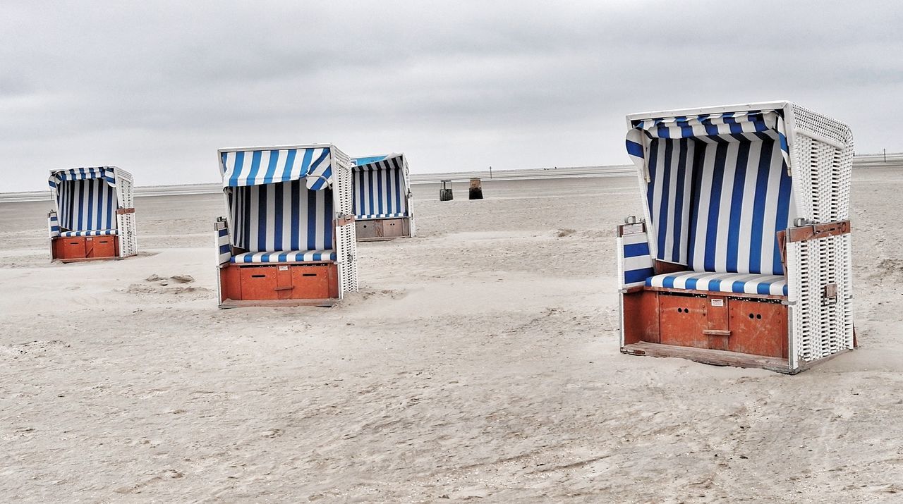 Hooded beach chairs on beach