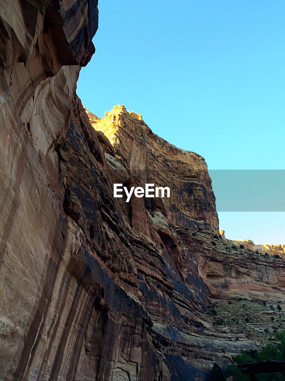 LOW ANGLE VIEW OF ROCKS AGAINST BLUE SKY