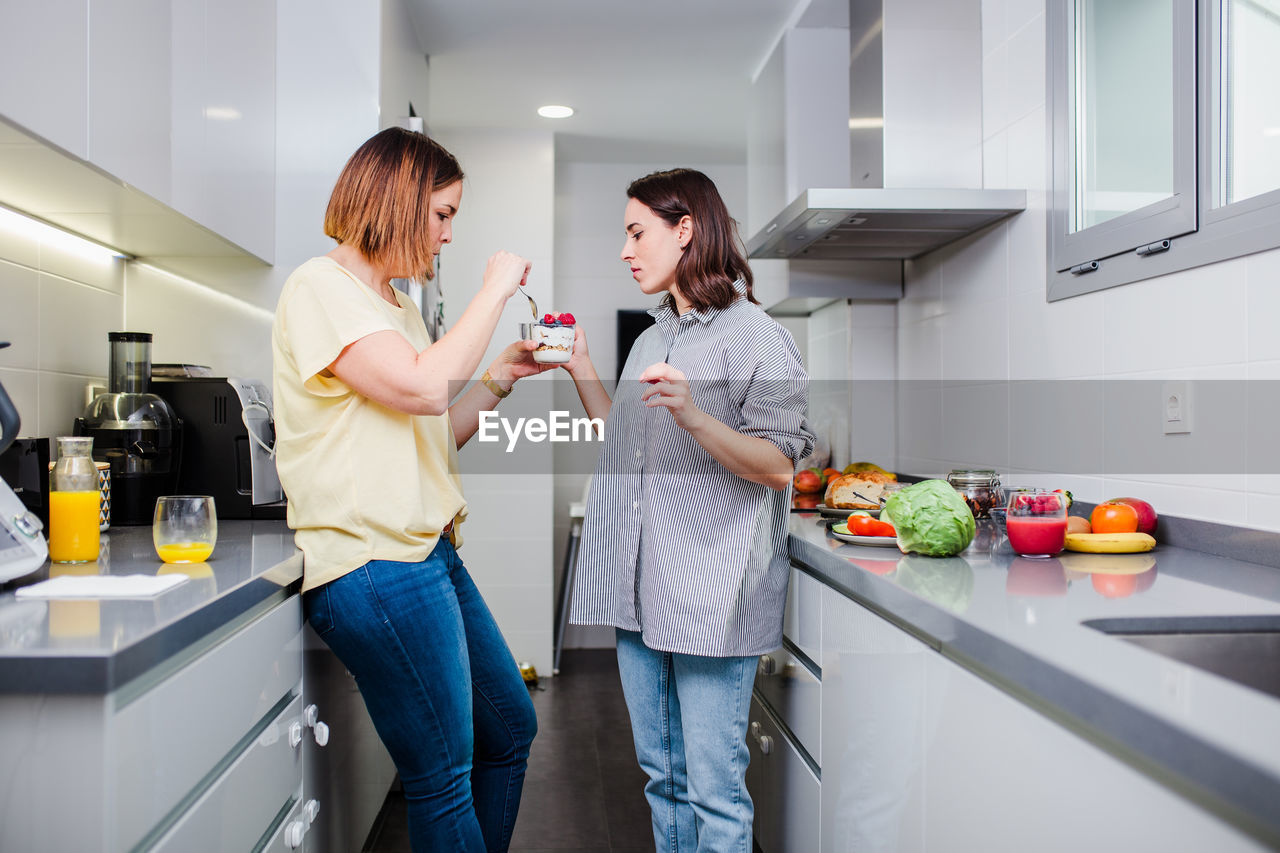 Women preparing food at kitchen