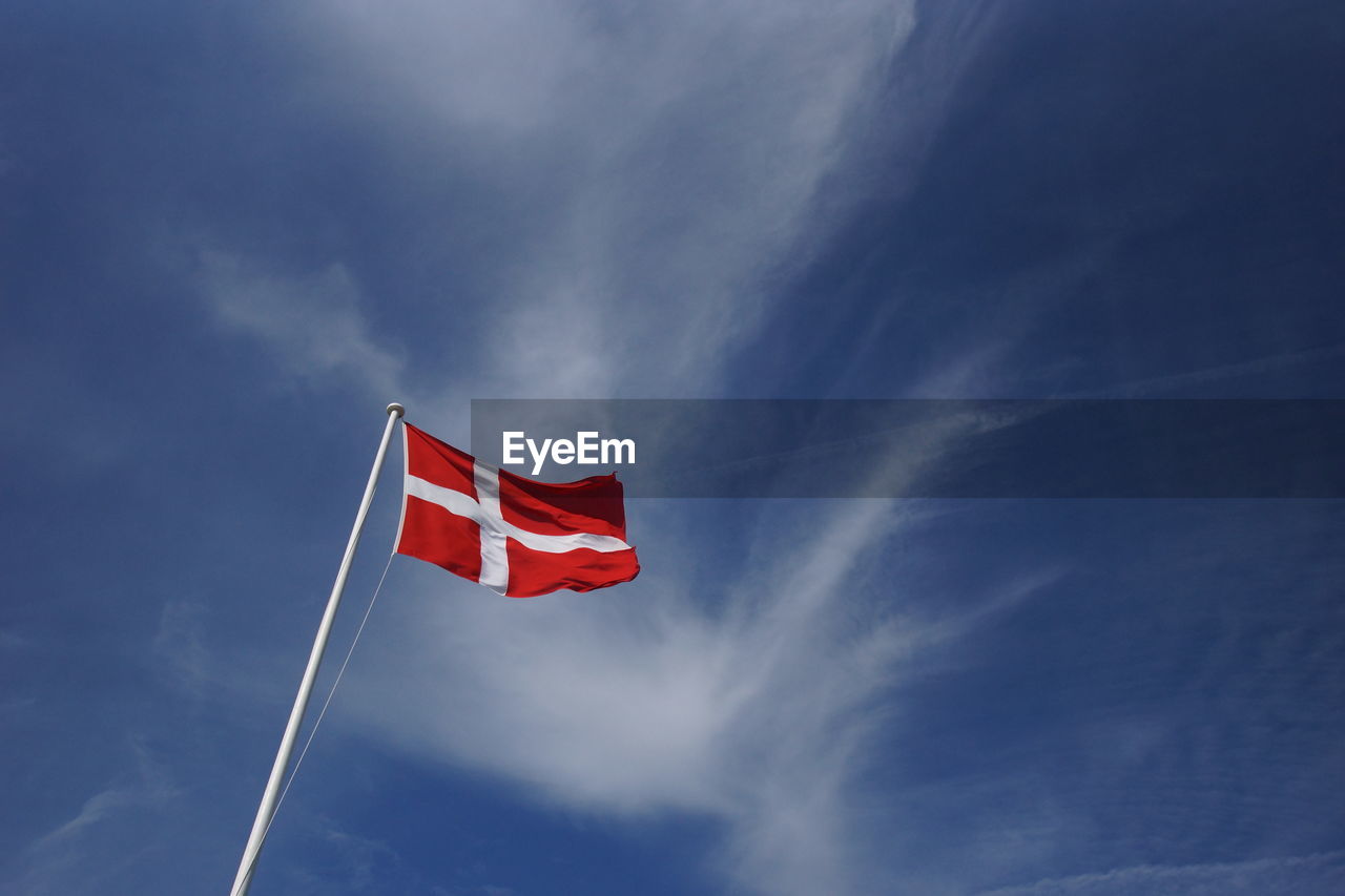 Low angle view of flag against sky