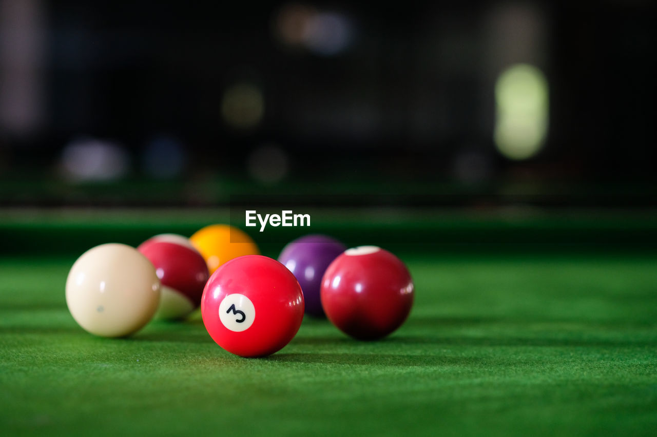 Close-up of multi colored balls on pool table