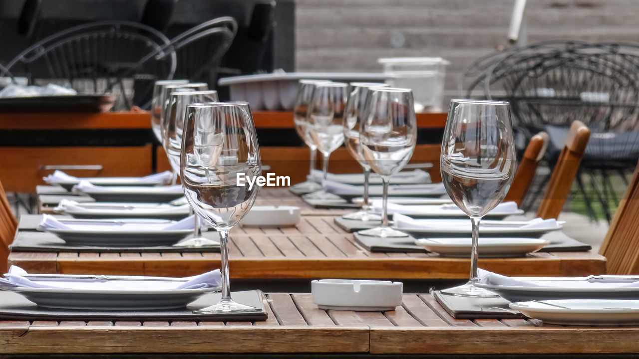 Empty chairs and tables on table in restaurant