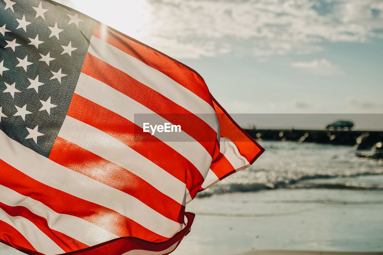 Close-up of flag against sky