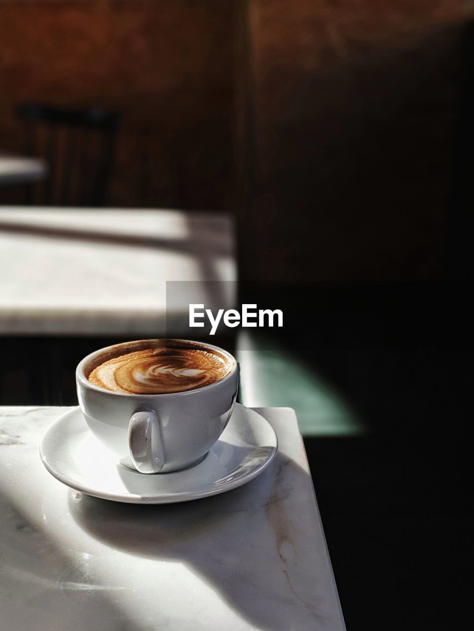 High angle view of coffee cup on table