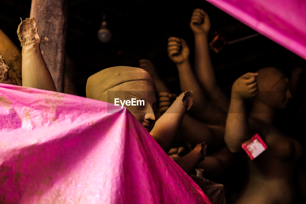 GROUP OF PEOPLE SITTING IN PINK