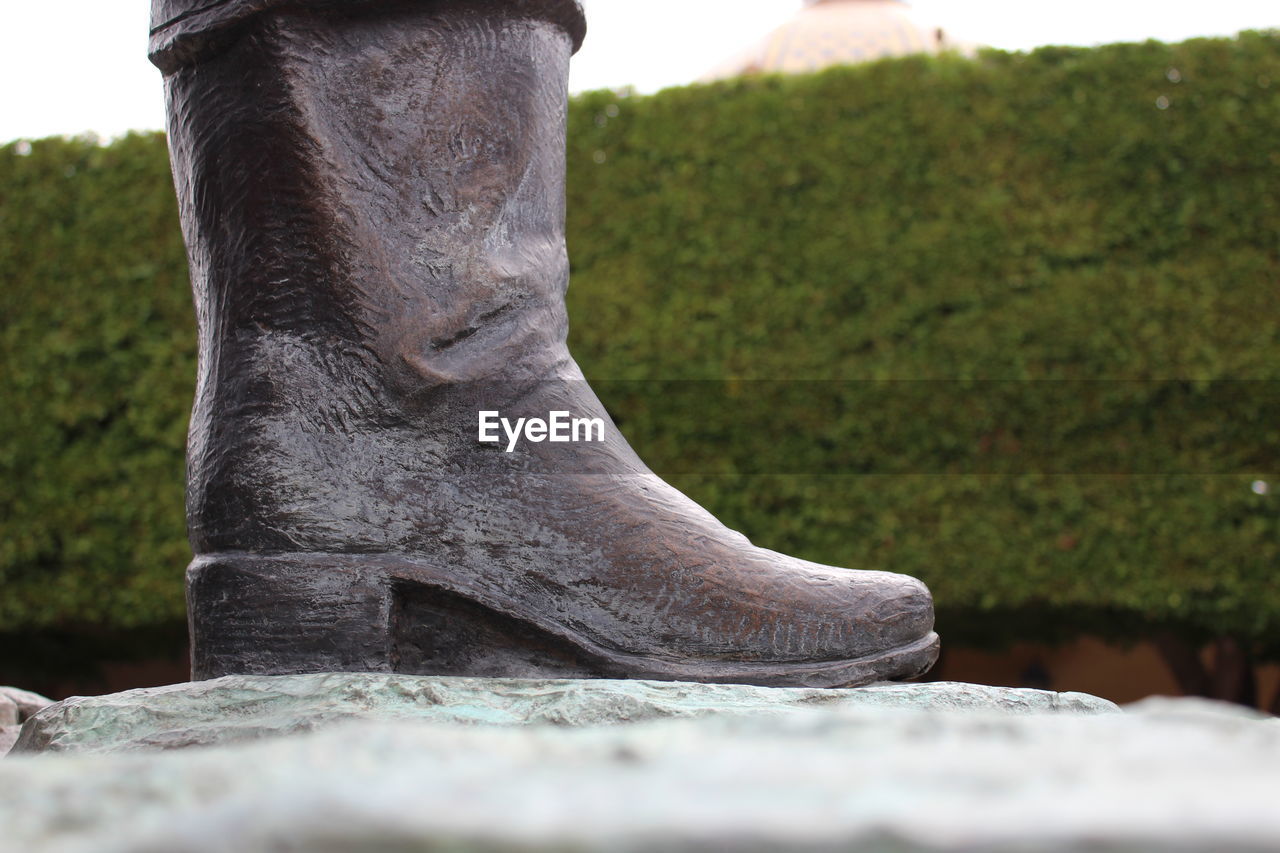 Close-up of statue on rock