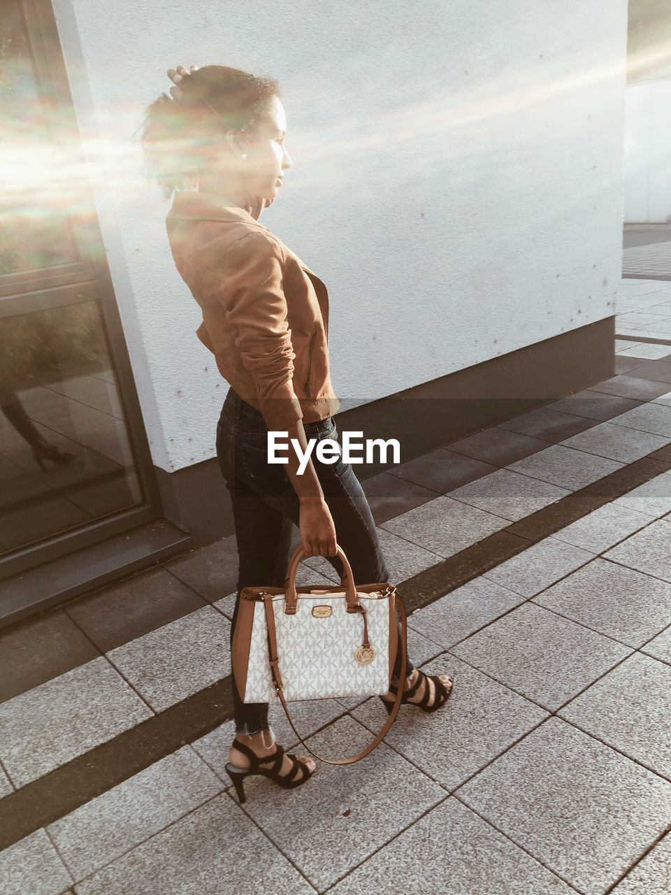 SIDE VIEW OF WOMAN LOOKING AT FOOTPATH