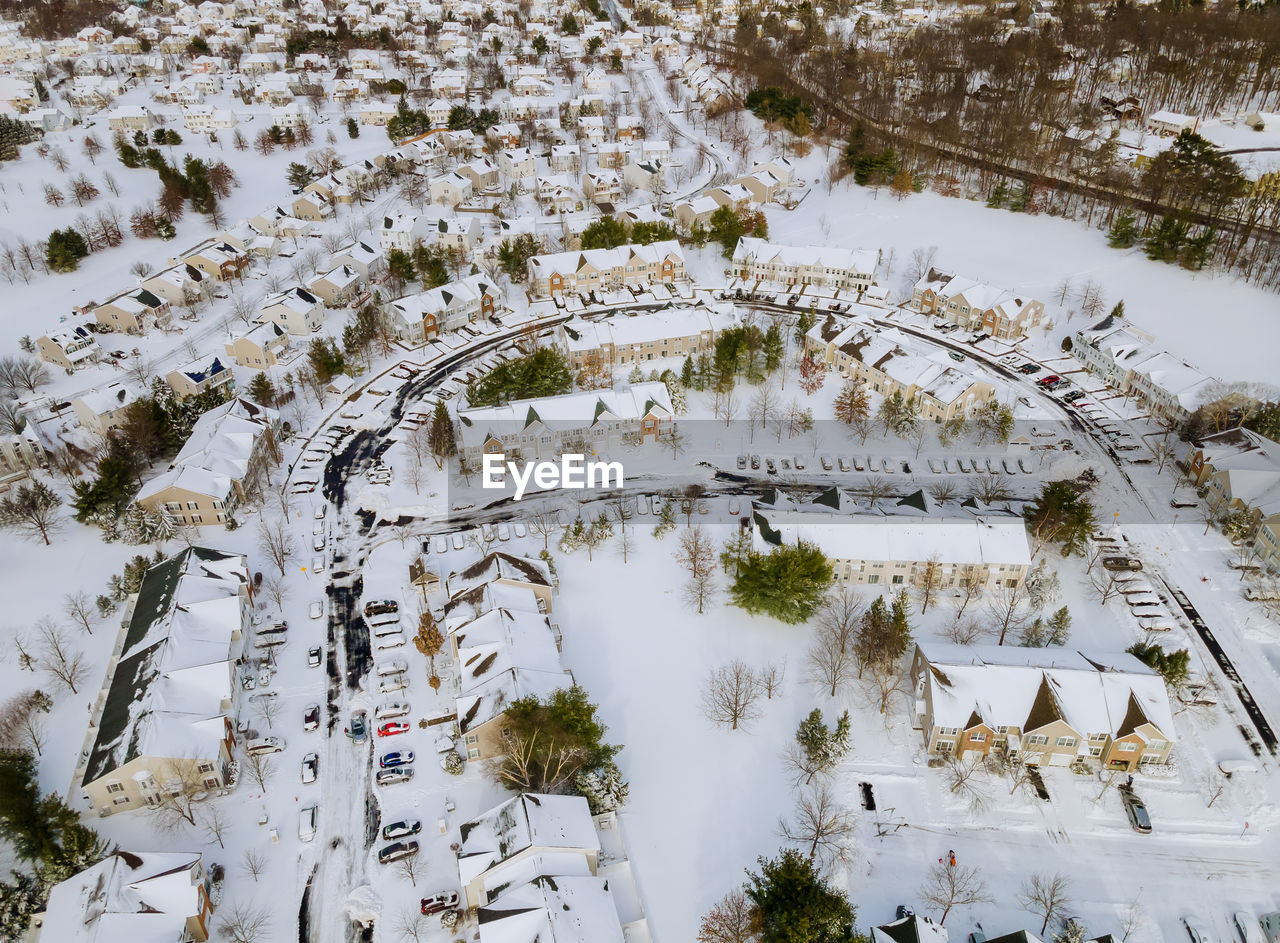 HIGH ANGLE VIEW OF SNOW COVERED LAND