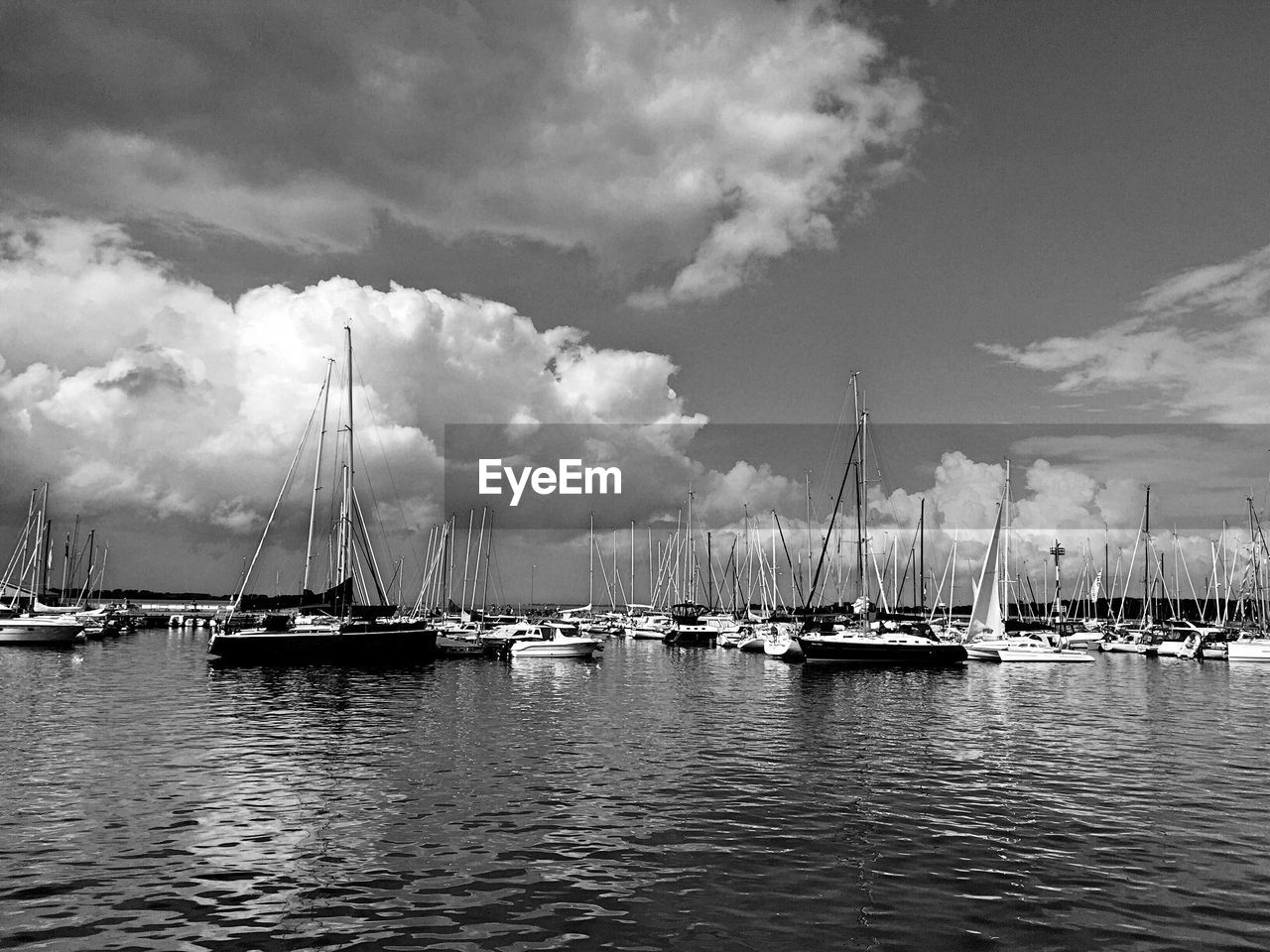 BOATS MOORED IN HARBOR