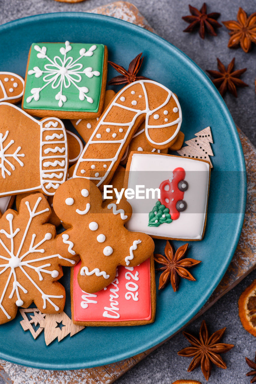 high angle view of gingerbread cookies in plate on table