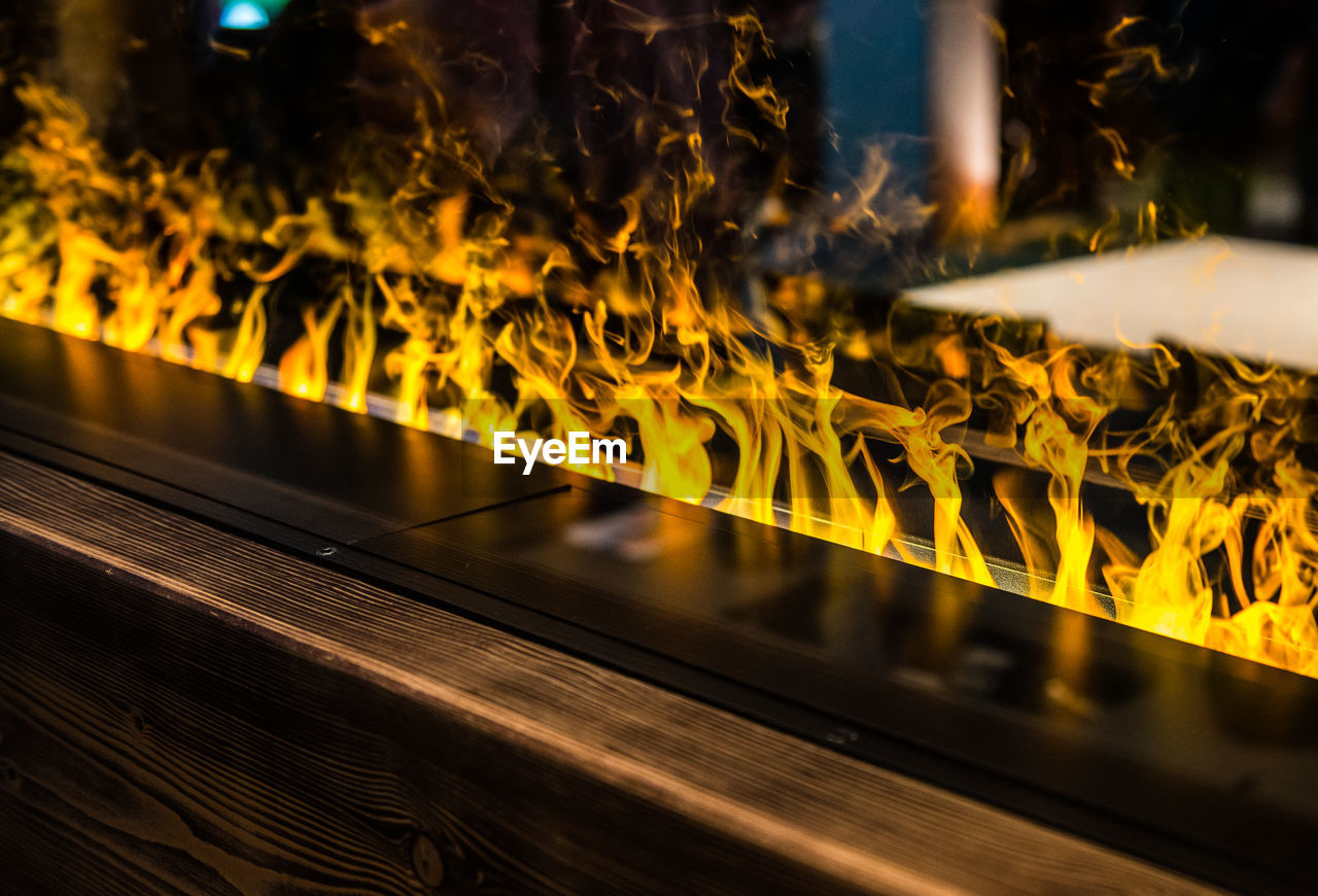 High angle view of illuminated electric fireplace at home