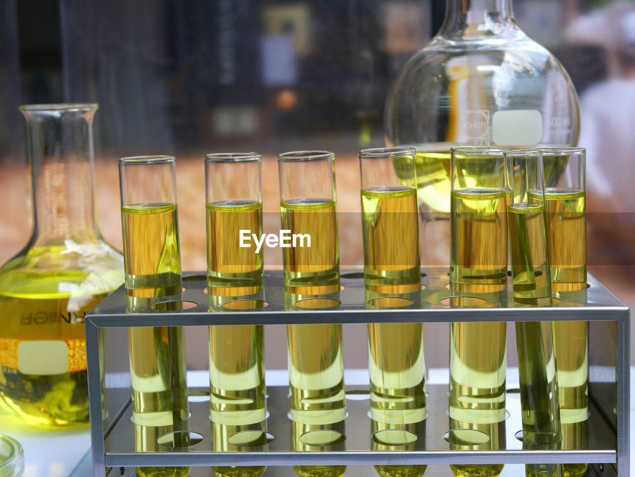 CLOSE-UP OF BOTTLES ON TABLE