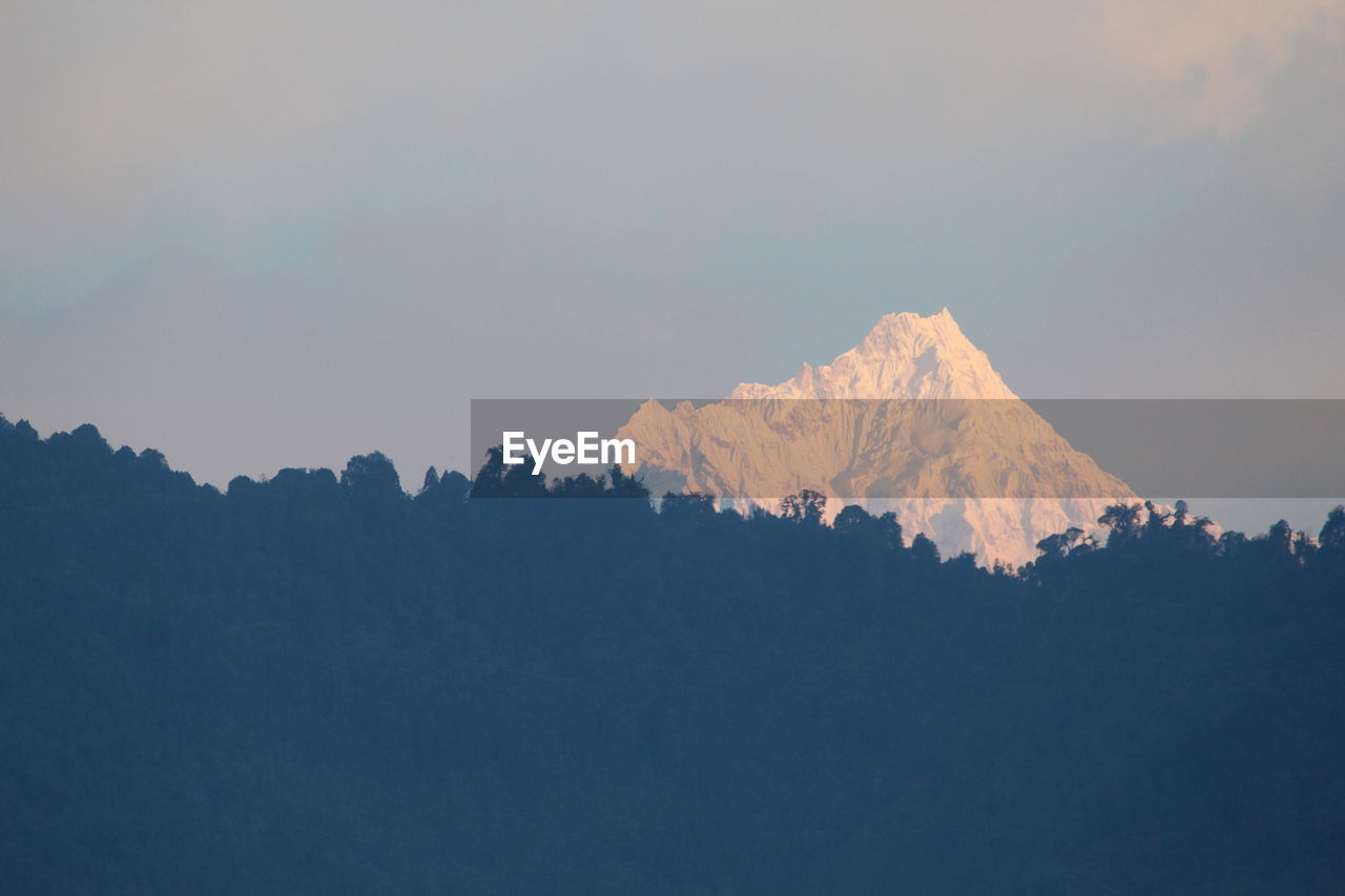 SILHOUETTE MOUNTAINS AGAINST SKY DURING SUNSET