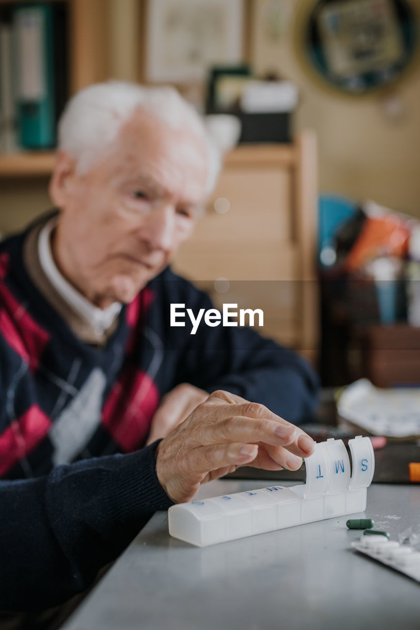 Portrait of man working on table