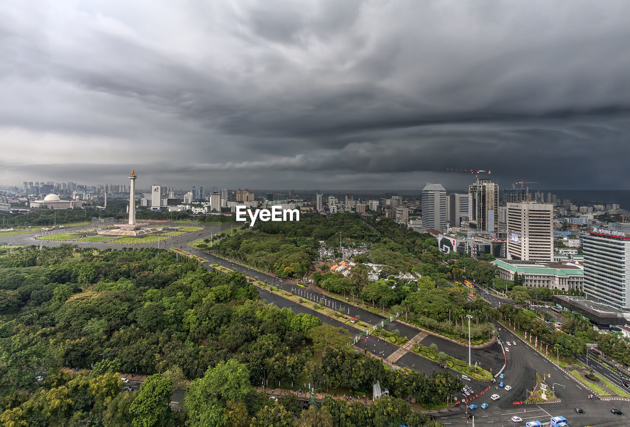 Aerial view of national monument in city against cloudy sky