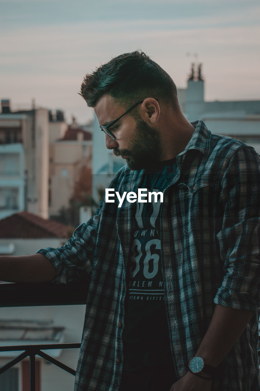 Young man looking away outdoors