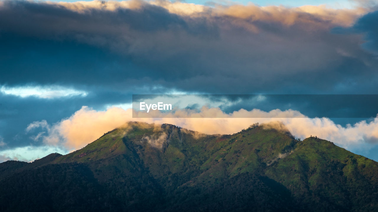 Scenic view of mountains against sky during sunset