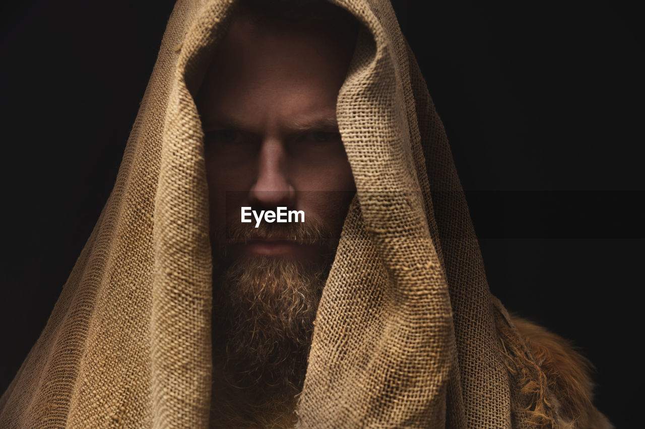 Close-up portrait of man with burlap