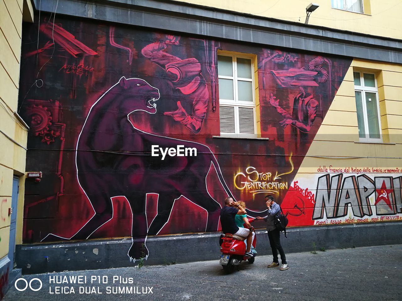 FULL LENGTH OF MAN WITH TEXT ON WALL