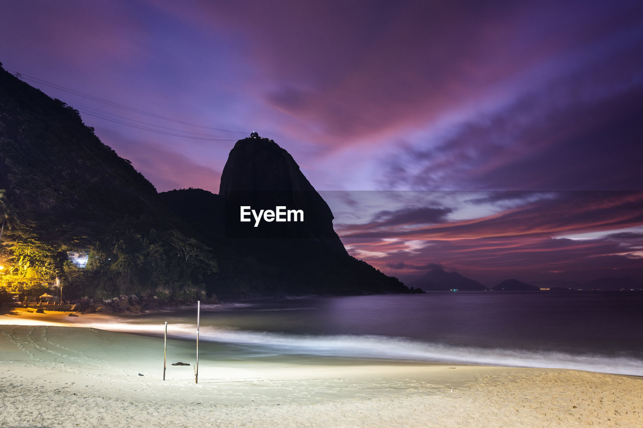 Beautiful pink and blue sunrise view from beach front to sugar loaf