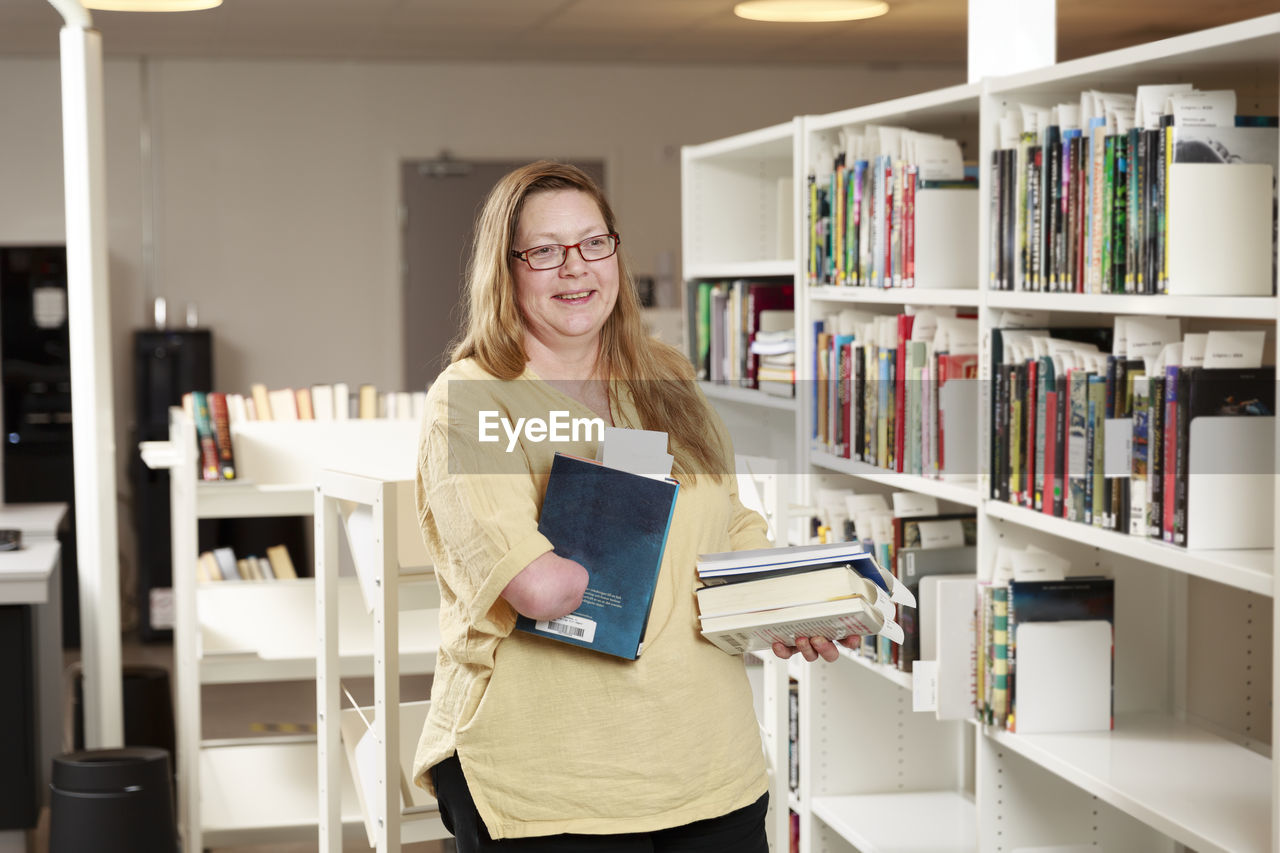 Portrait of librarian holding a book