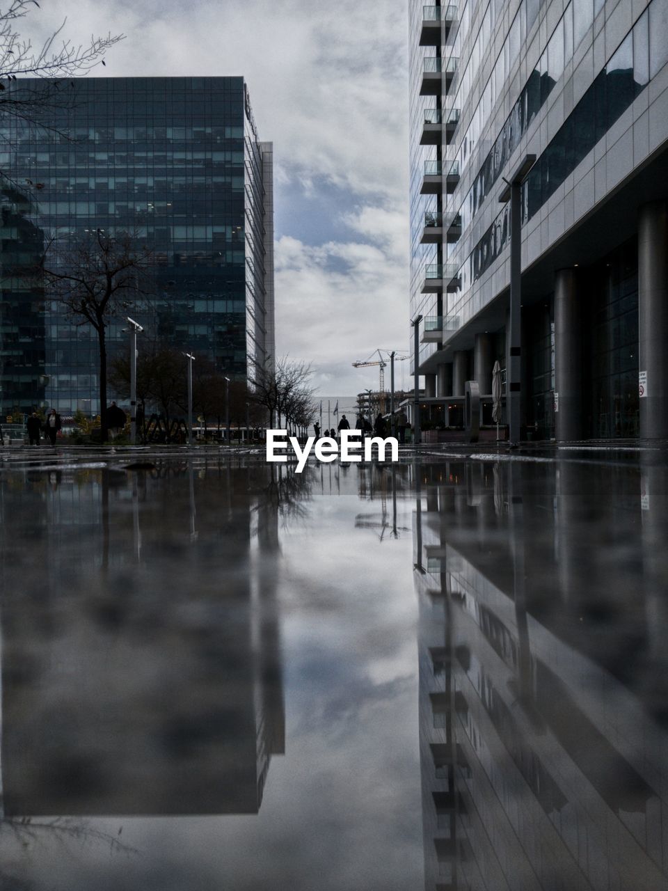 Reflection of buildings in puddle