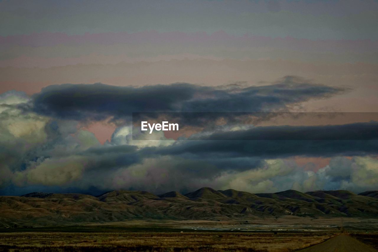 SCENIC VIEW OF RAINBOW OVER MOUNTAINS