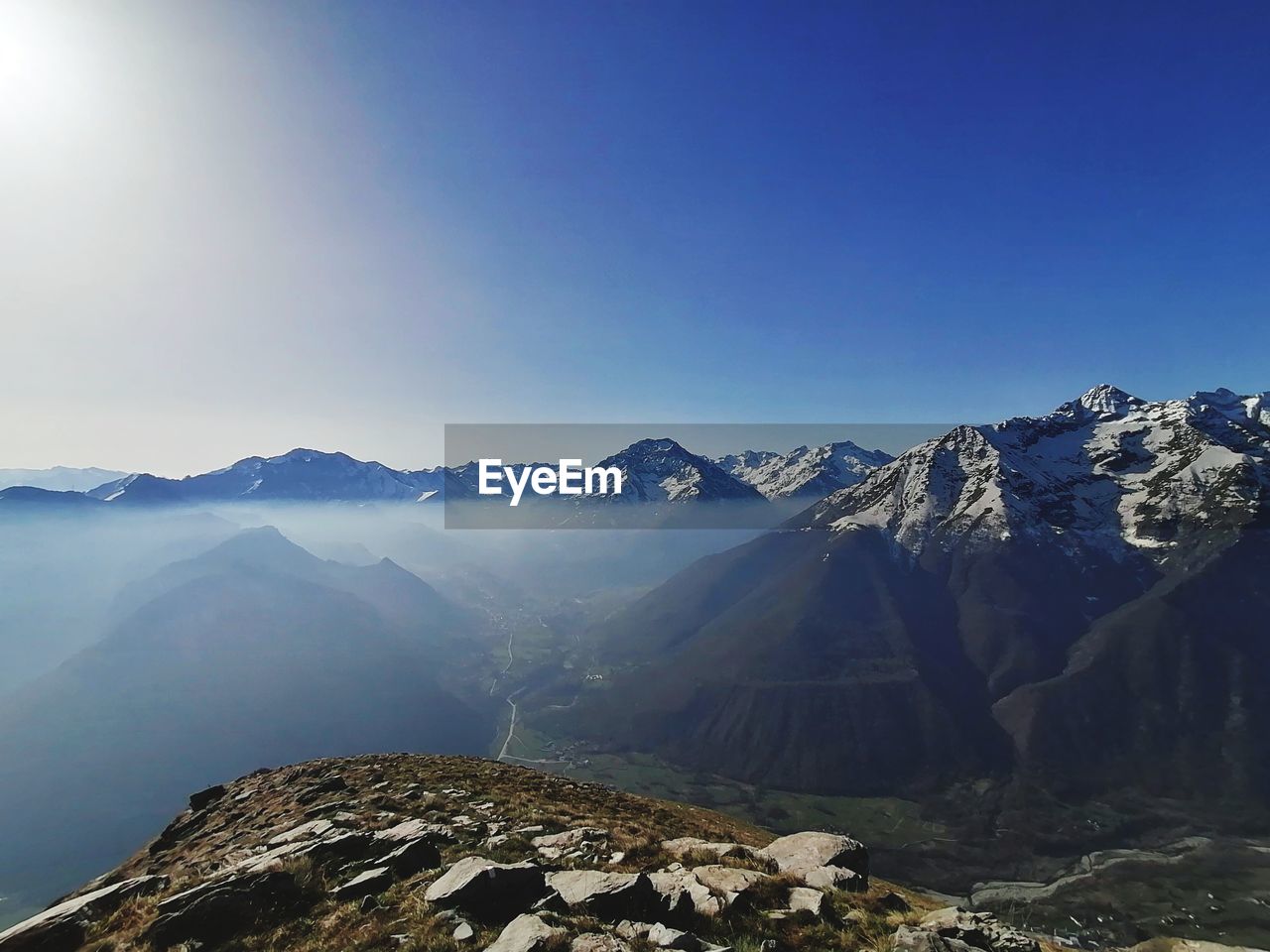 Scenic view of snowcapped mountains against clear sky