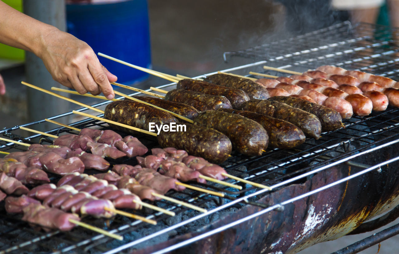 MEAT COOKING ON BARBECUE