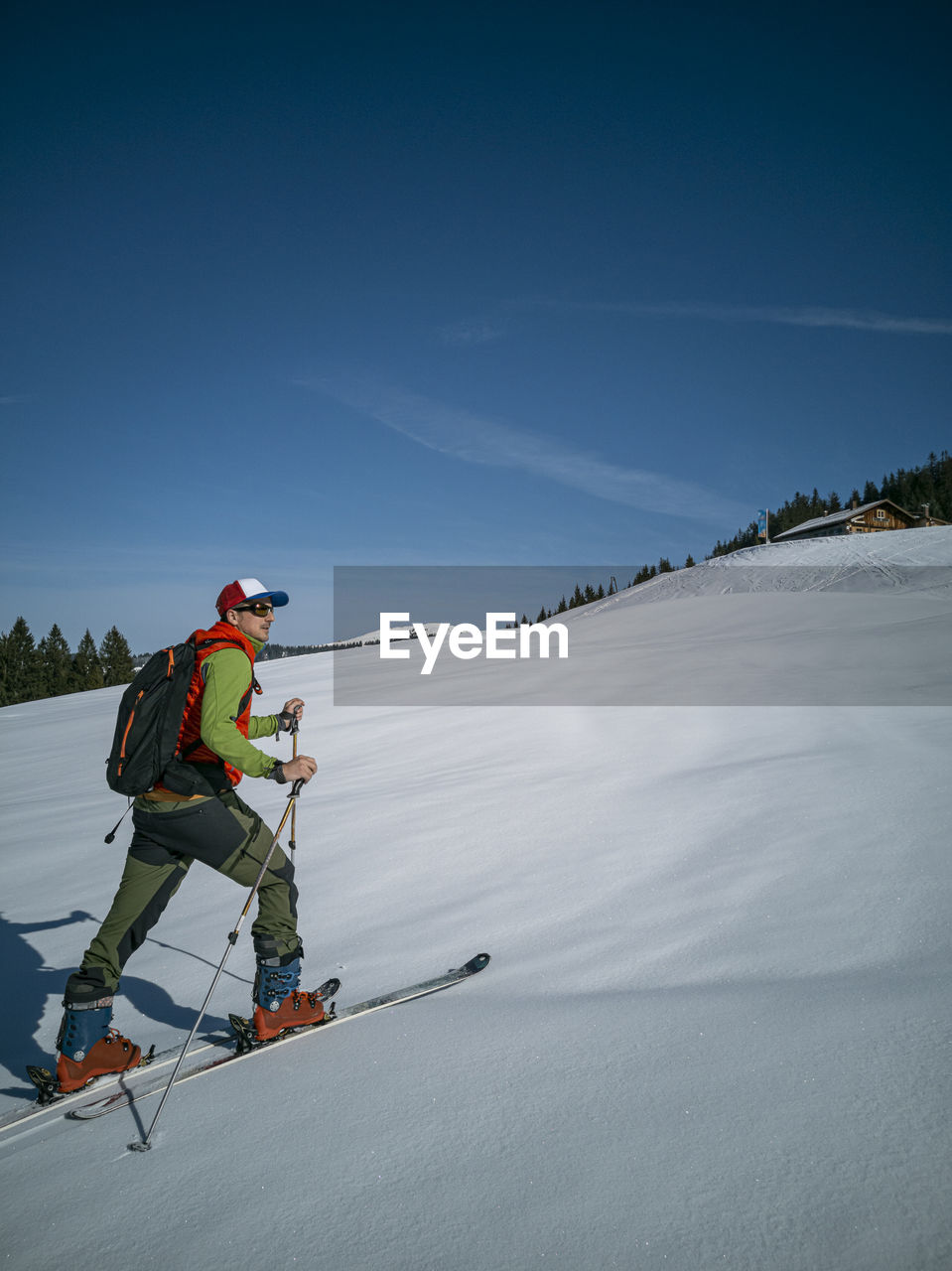 Full length of man skiing on snow covered land