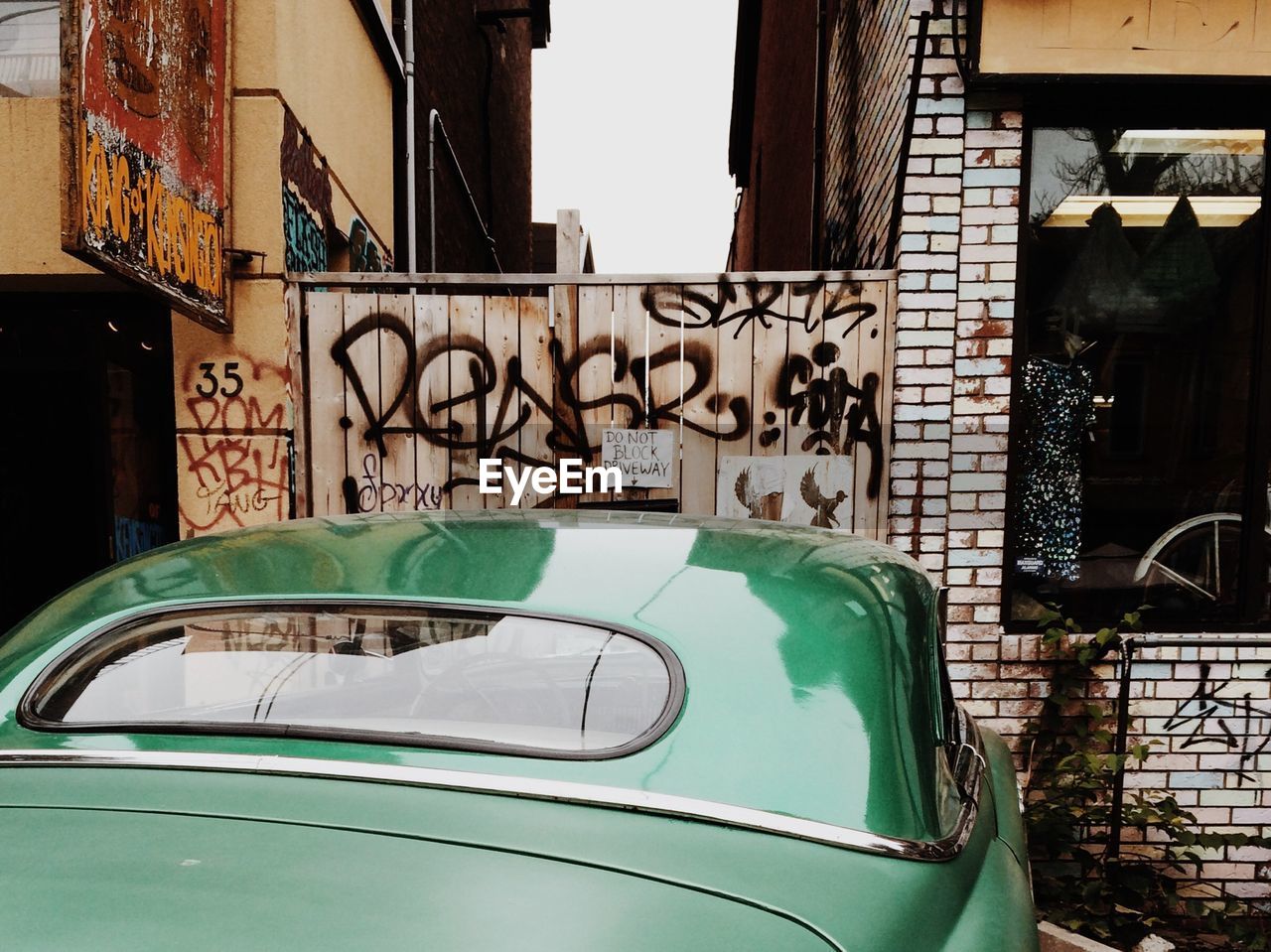 Car parked in front of wooden door