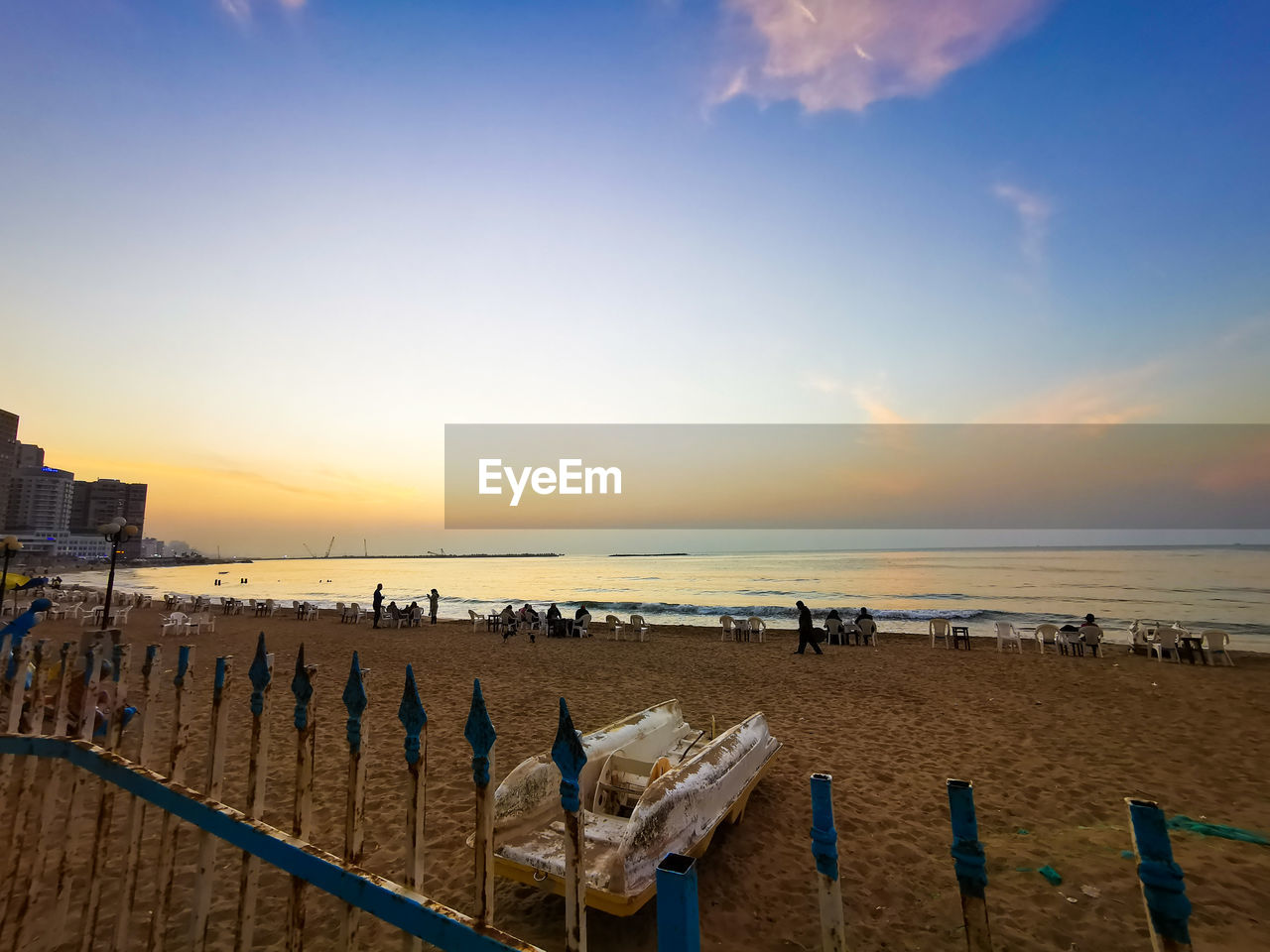 Scenic view of beach against sky during sunset