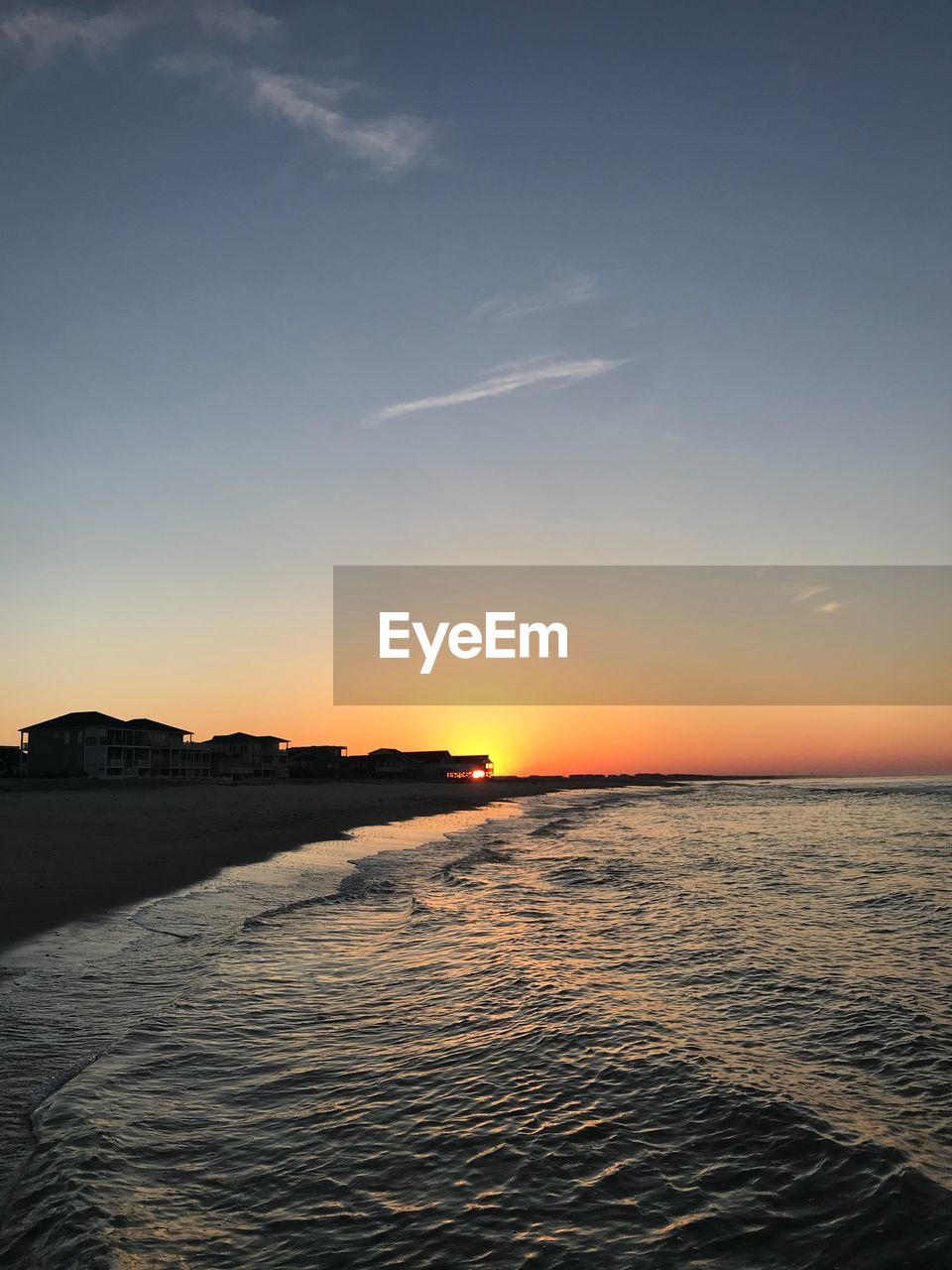 SCENIC VIEW OF SEA AT SUNSET