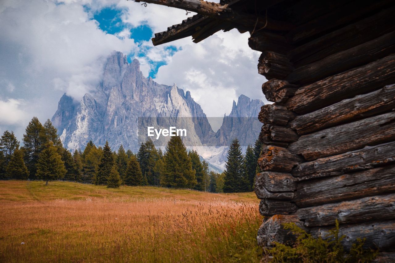 Scenic view of mountains against cloudy sky