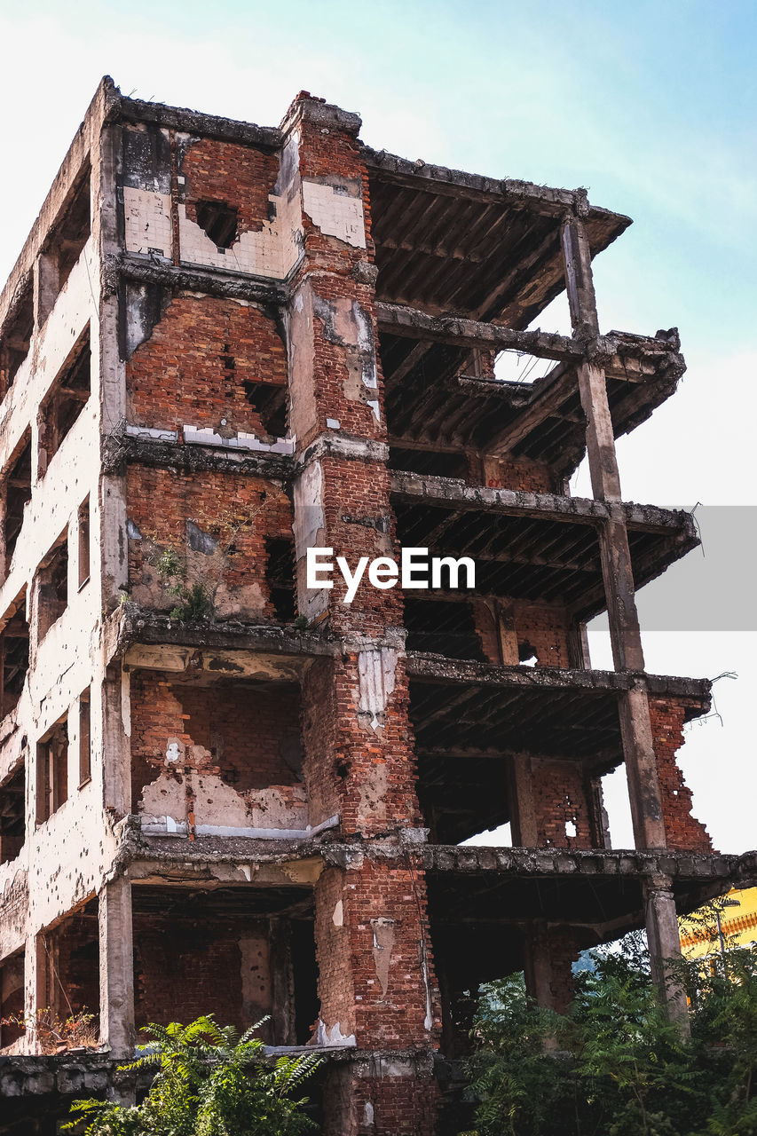 Low angle view of old building against sky