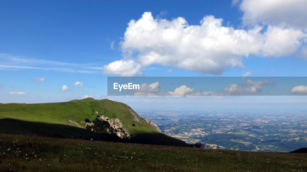 SCENIC VIEW OF LANDSCAPE AGAINST BLUE SKY