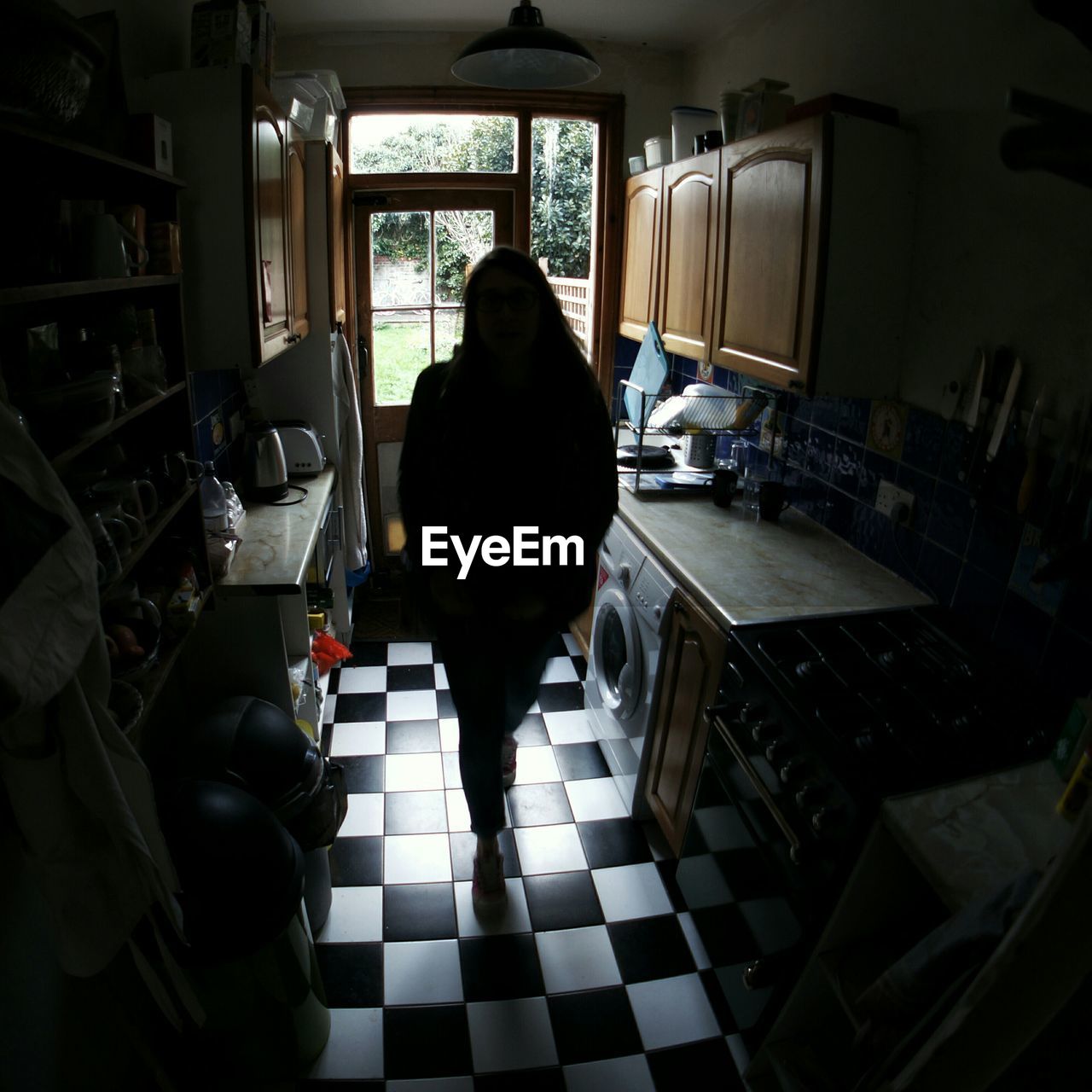 WOMAN IN BACKGROUND