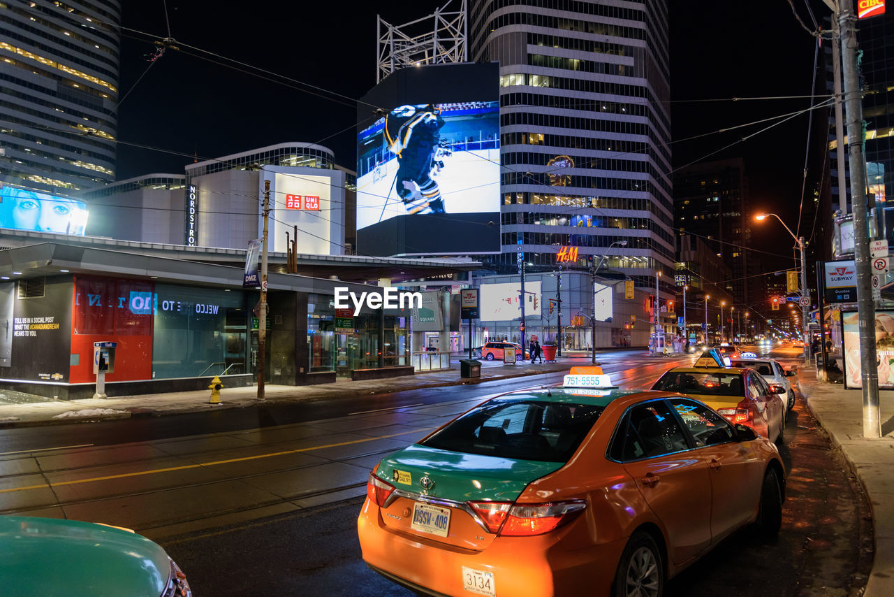 TRAFFIC ON CITY STREET AT NIGHT