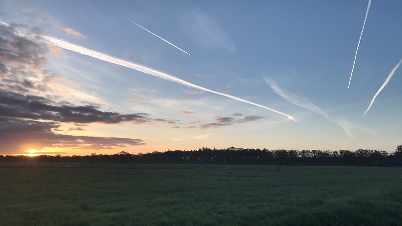 SCENIC VIEW OF SILHOUETTE FIELD AGAINST SKY DURING SUNSET