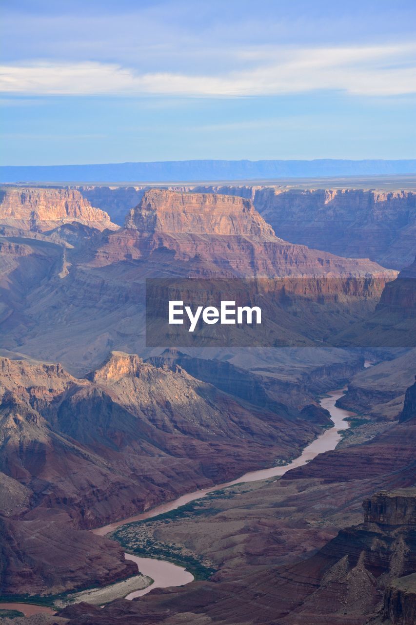 Scenic view of colorado river by rocky mountains at grand canyon national park