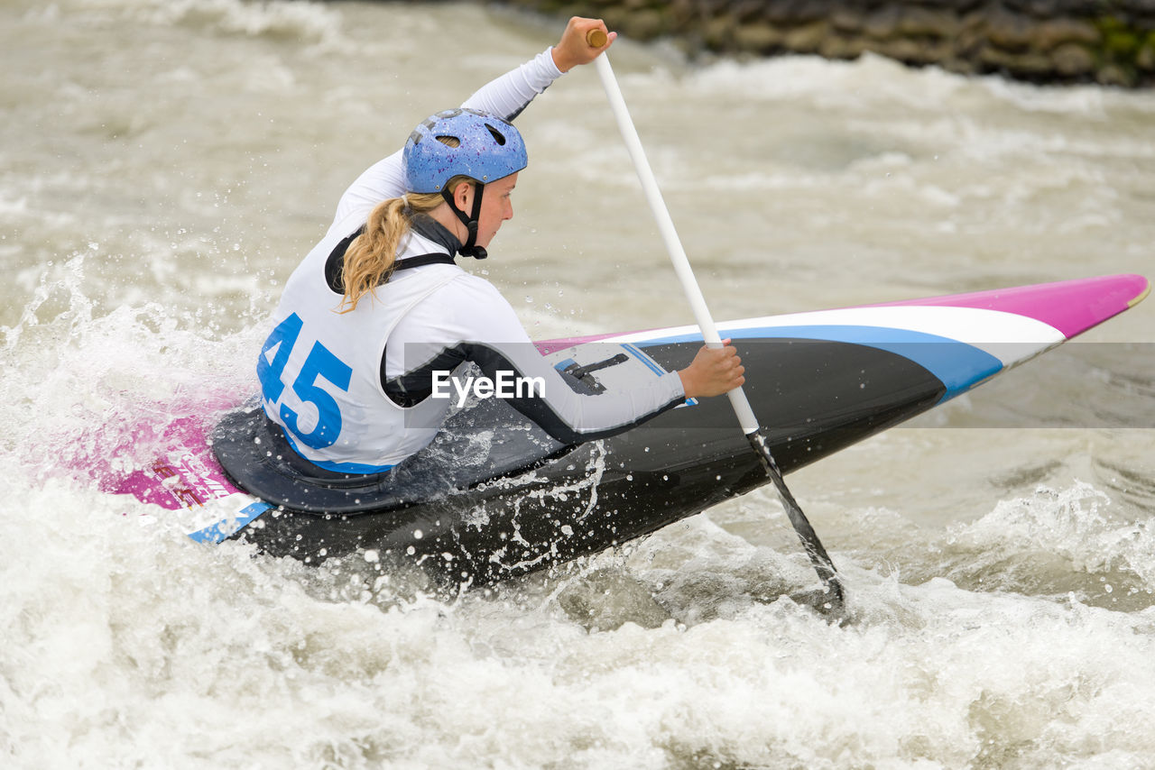 Woman kayaking at river