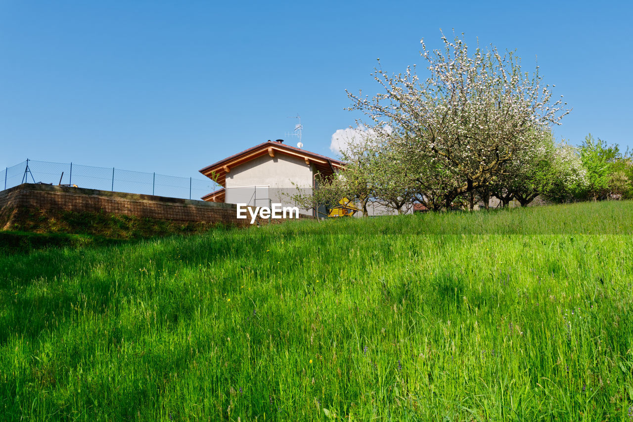 Built structure on field against clear sky