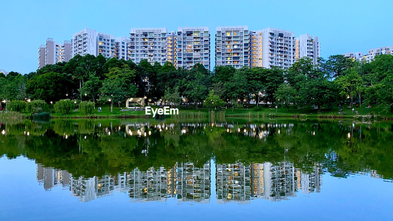 REFLECTION OF BUILDING ON LAKE