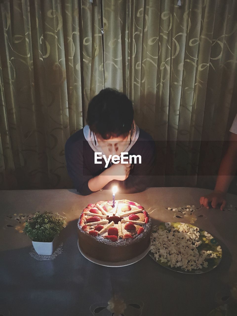 BOY WITH ICE CREAM IN PLATE