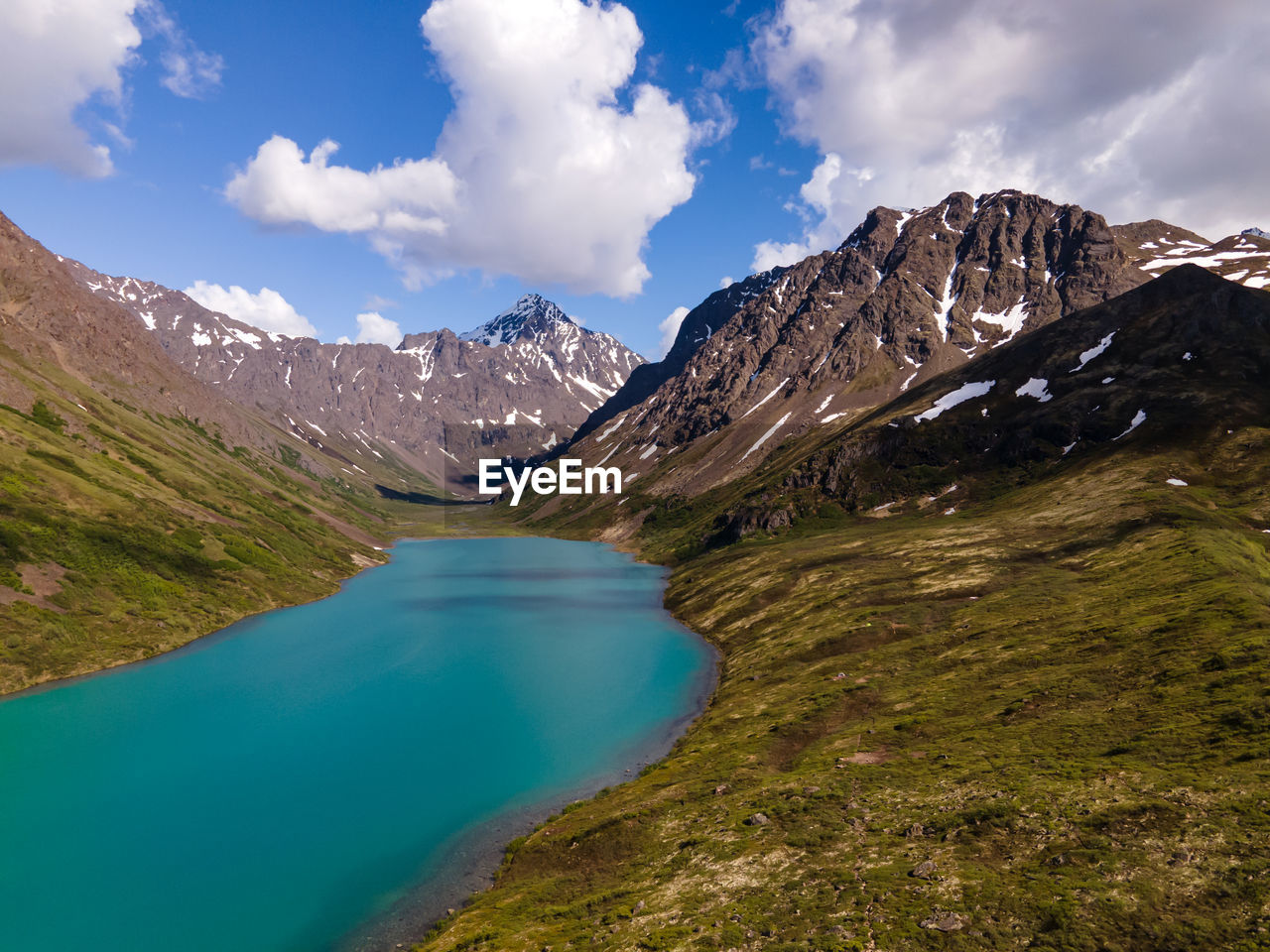 SCENIC VIEW OF LAKE AND SNOWCAPPED MOUNTAINS AGAINST SKY