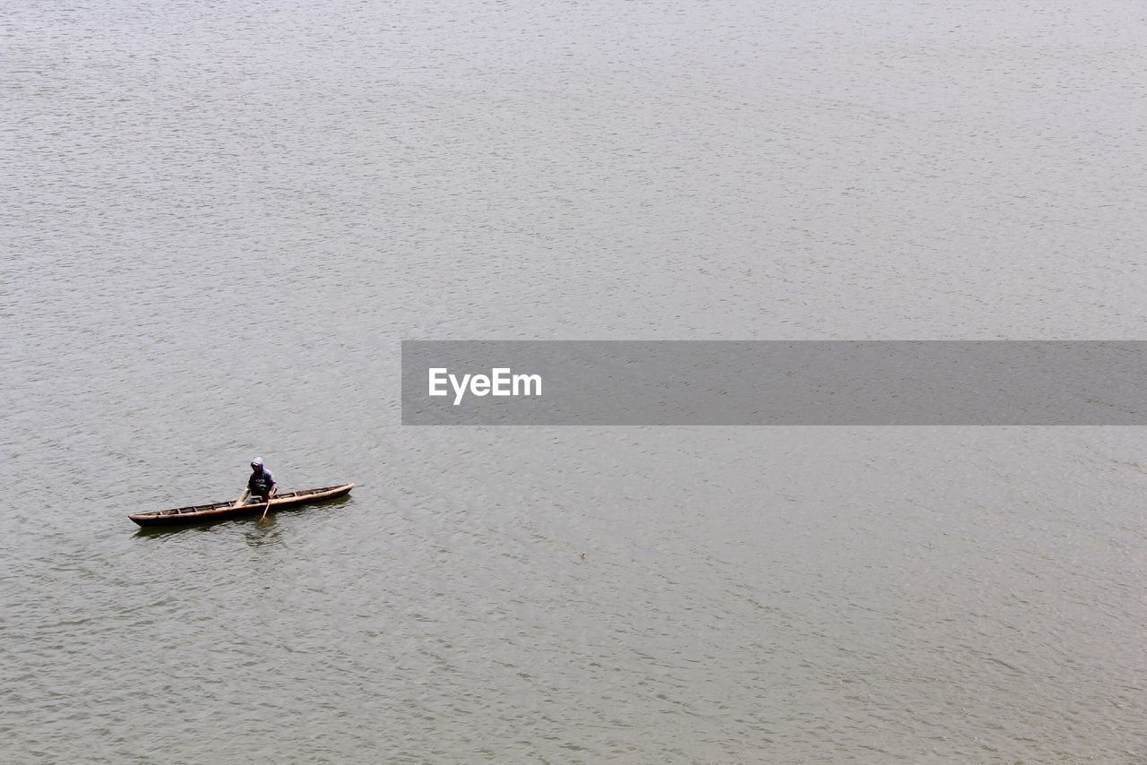 High angle view of man rowing boat