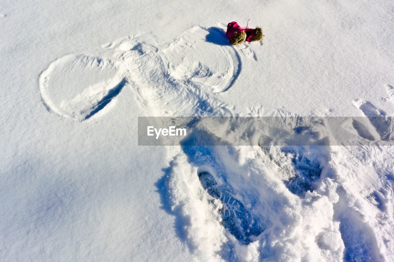 High angle view of toy on snowcapped field during winter